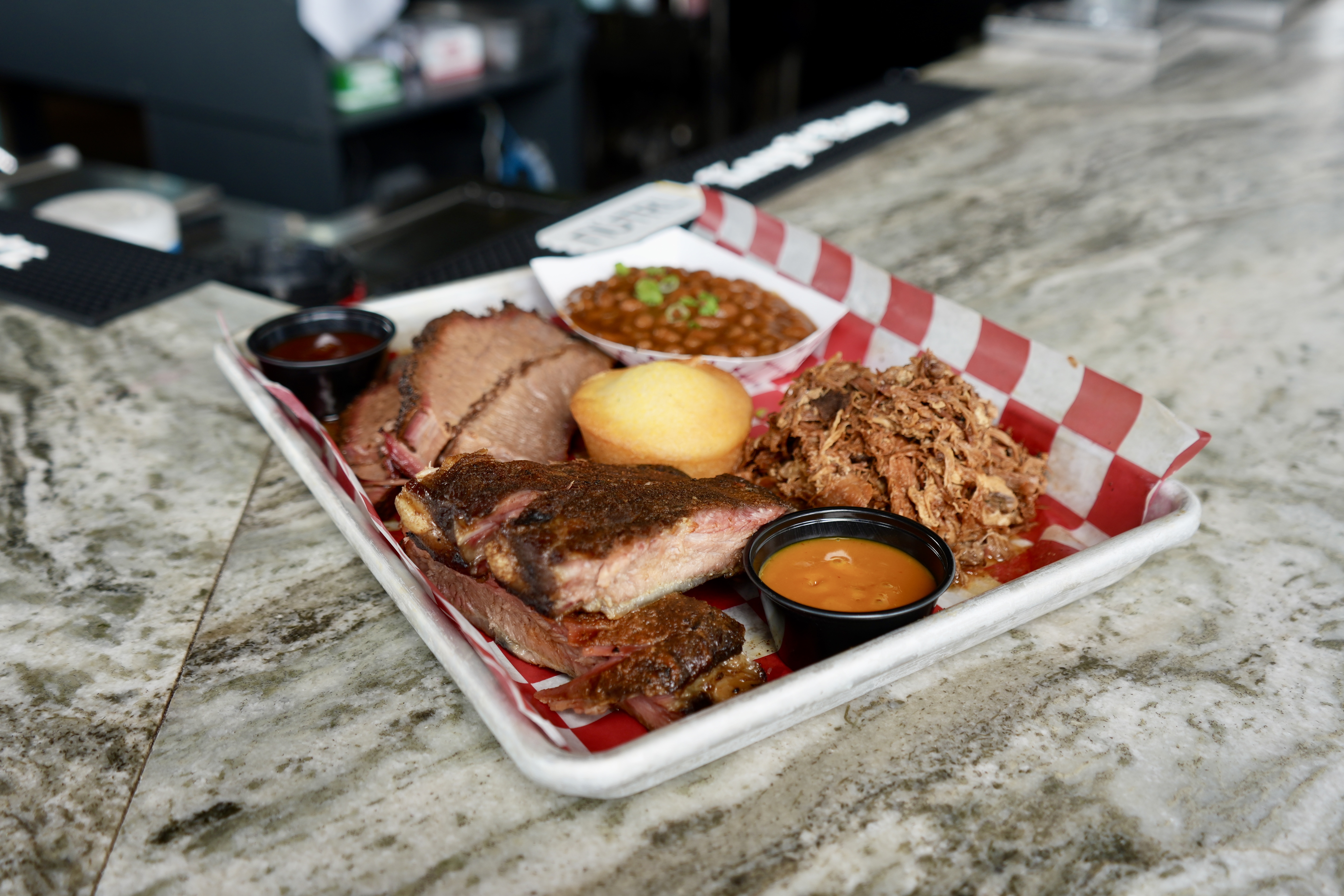 Smoked brisket, ribs, pulled pork & beans tray