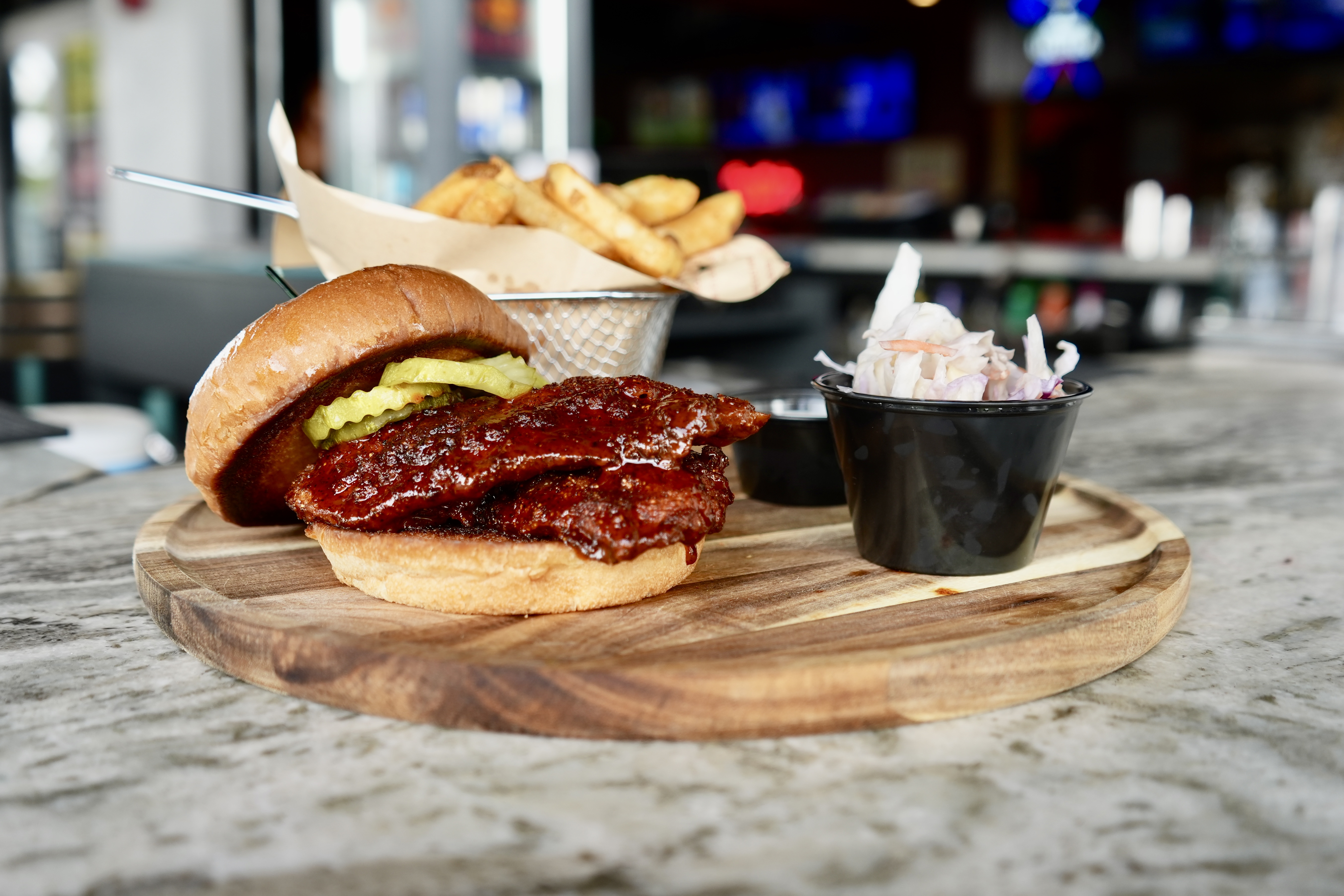 Nashville hot chicken sandwich with fries & slaw